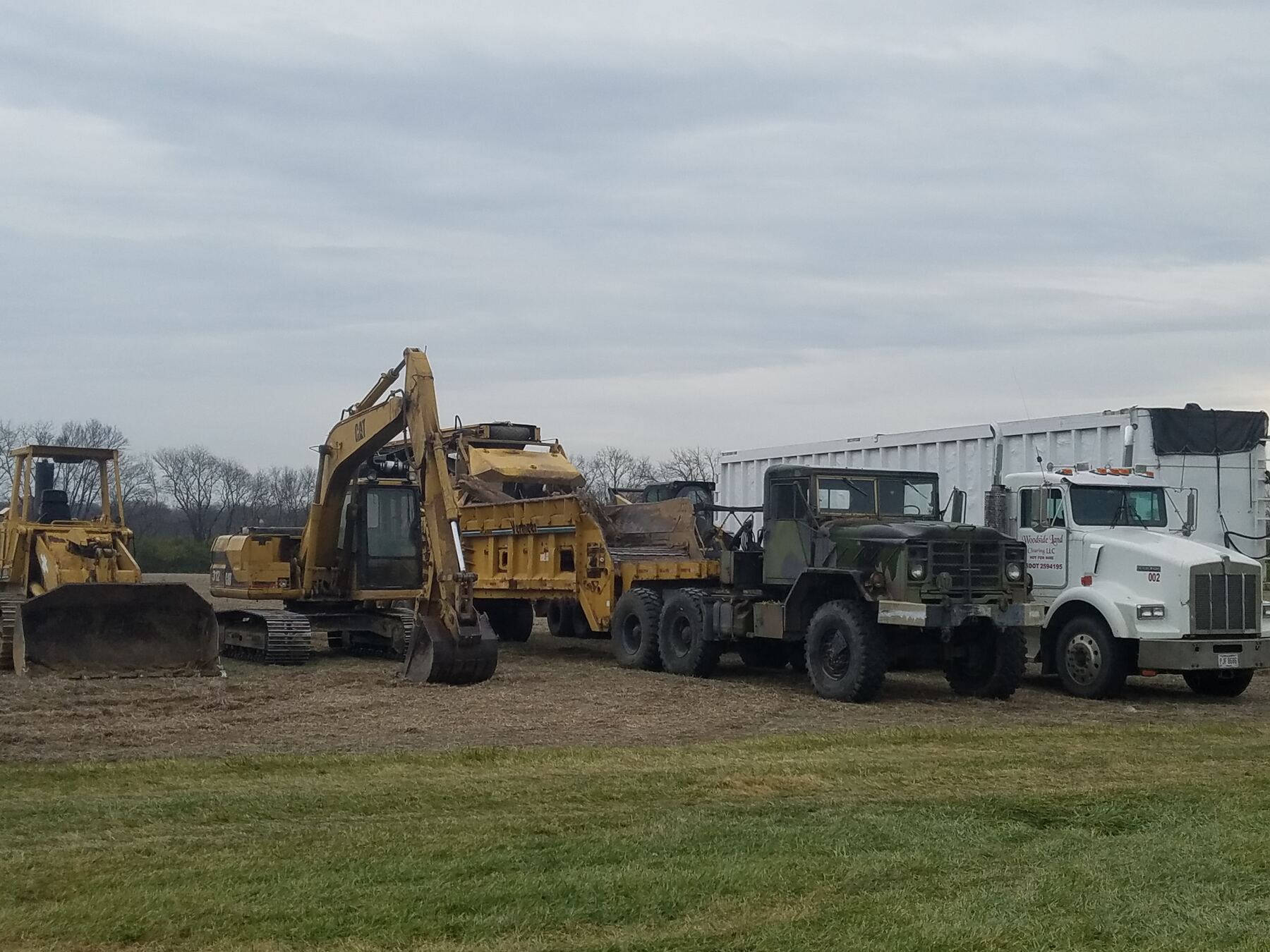 Land clearing equipment at work on a cleared lot